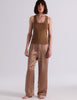 A model posing in the Araks organic cotton brown Terra James Tank. 