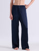A model wearing Araks silk pajama Viktoria pants in Sea