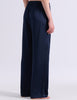 A model wearing Araks silk pajama Viktoria pants in Sea