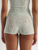 A model in the araks french lace guinevere shorts in caledonia