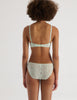 A model in the araks french lace tamara bralette and tris panty in caledonia green