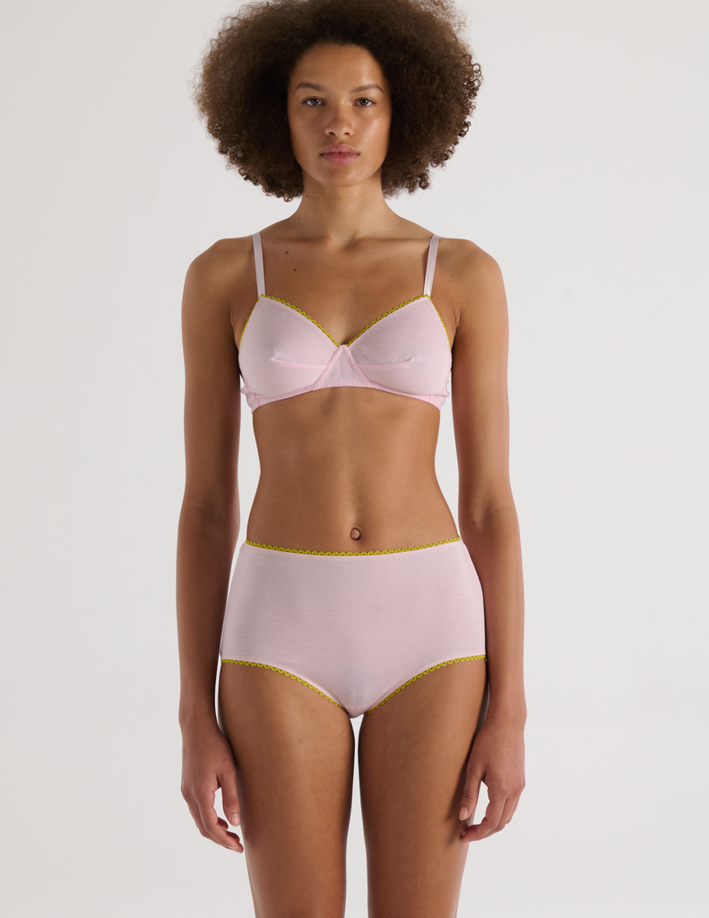 A model in the araks organic cotton antonia bralette and mabel hipster in confection pink