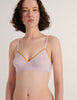 a model in the araks organic cotton antonia bralette in lavender fairy