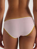 A model in the araks organic cotton isabella panty in confection pink