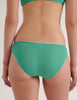 A model in the araks organic cotton isabella panty in glass green