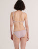 a model in the araks organic cotton antonia bralette and isabella panty in fairy lavender from the back