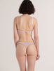 A model from the back in the araks 100% organic cotton antonia bralette and stella thong in fairy lavender