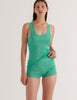 A model in the araks organic cotton james tank top in glass green