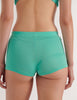A model in the araks organic cotton presley short in glass green