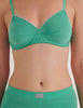 A model in the araks organic cotton antonia bralette and presley short in glass green