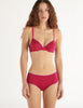 a model in the araks organic cotton sofia underwire and josephine hipster in cherie pink