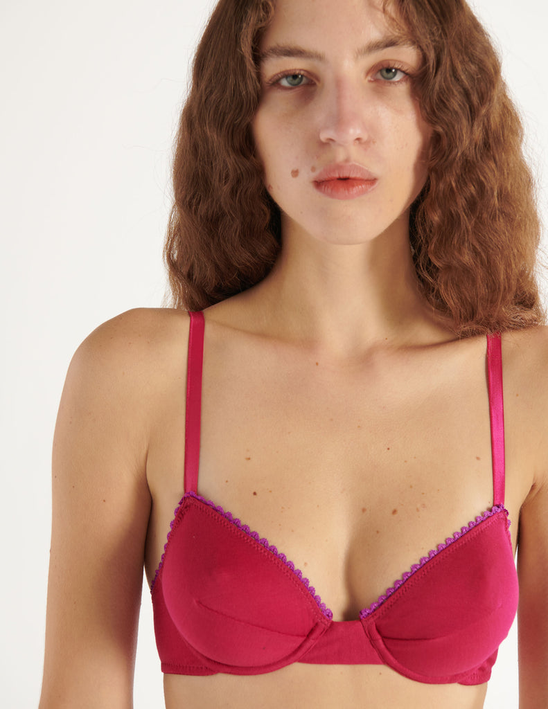 a model in the araks organic cotton sofia underwire and josephine hipster in cherie pink