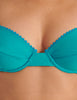 Teal organic cotton sofia Underwire bra worn by a person on a beige background
