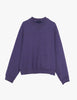 A flat lay image of the Araks Valerie crewneck in the shade Violette, against a white background. 