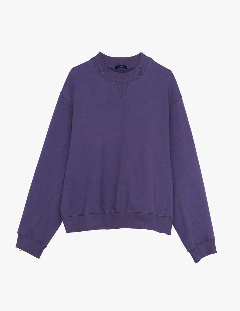 A flat lay image of the Araks Valerie crewneck in the shade Violette, against a white background. 