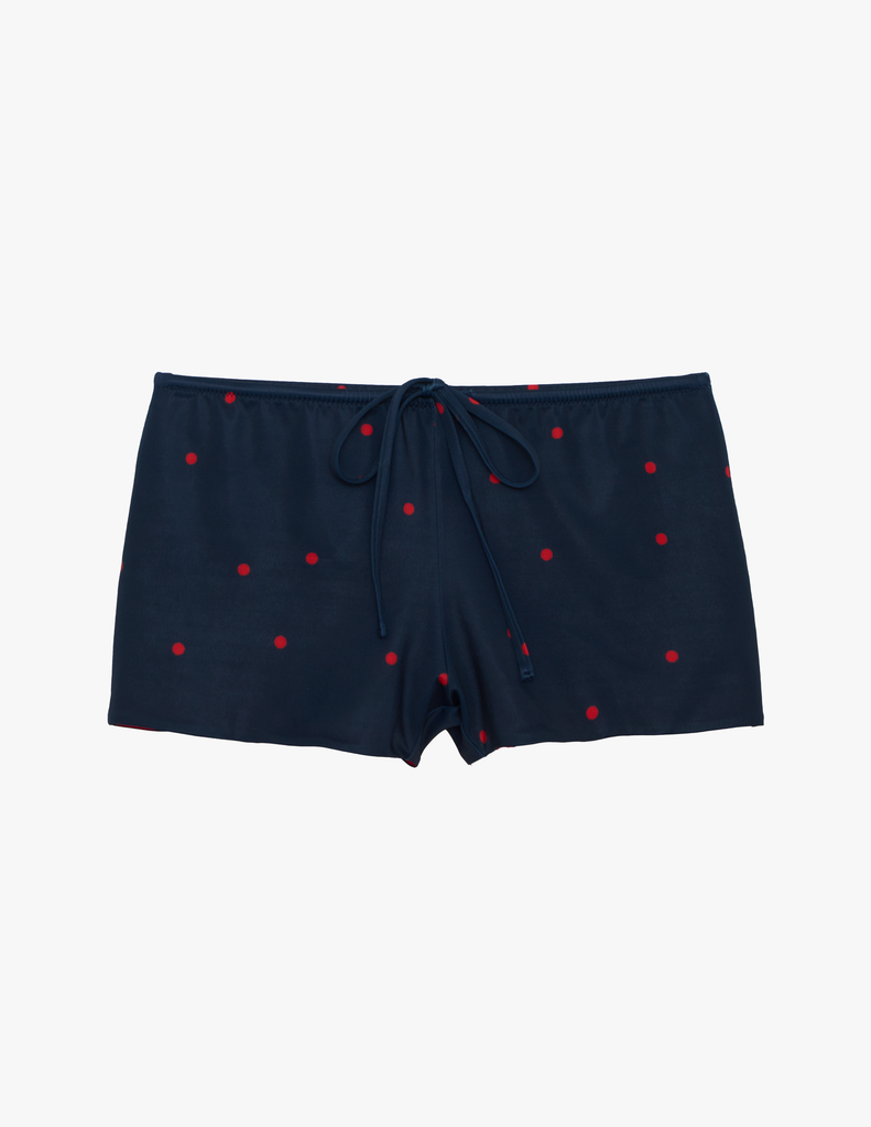 Araks Navy blue shorts with red polka dots on a light gray background