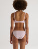 A model in the araks recycled cotton briar bralette and josie panty in confection pink