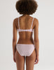 A model in the araks recycled cotton beau underwire and josie panty in confection pink