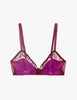 A sheer mesh and satin bra in a vibrant magenta-purple color displayed against a solid off-white background.