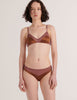 A model from the front in the araks silk beatrice bralette and aaron panty in noisette brown