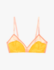 A model in the araks silk beatrice bralette in pomelo yellow
