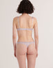 A model in the araks silk charmeuse gita underwire bra and grier thong in fairy lavender