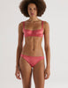 A model in the gita underwire bra and gwyneth panty in rose pink