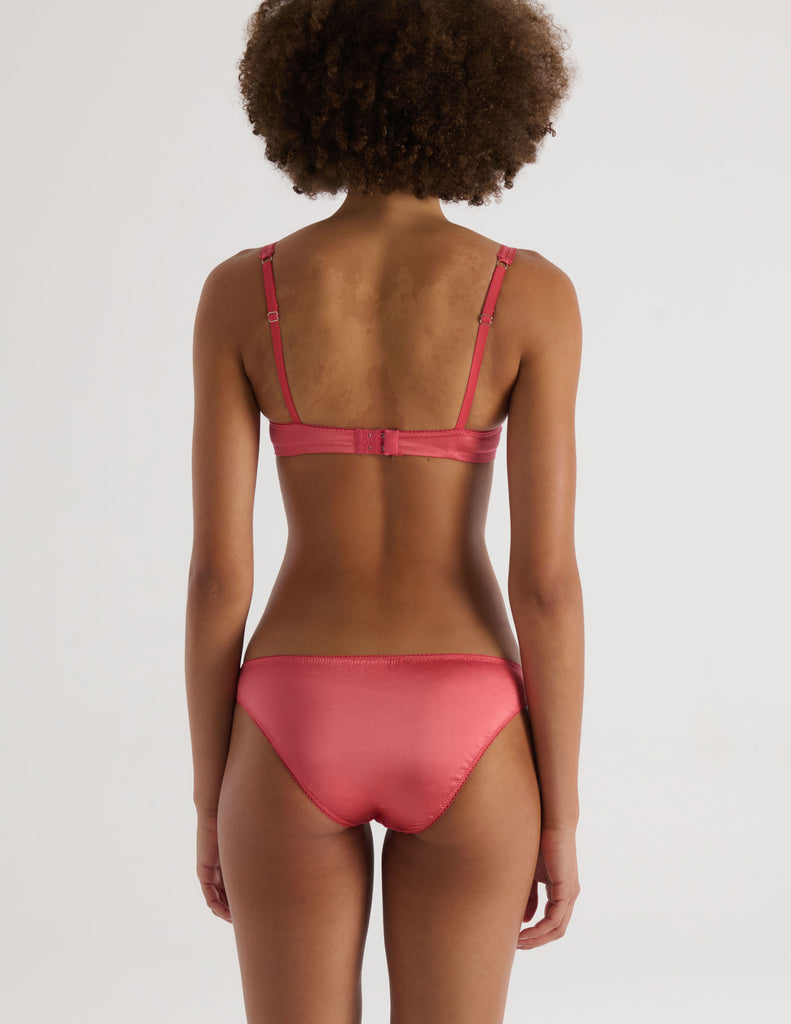 A model in the araks silk charmeuse gita underwire and gwyneth panty in rose pink