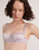 A model in the araks silk gita underwire bra in fairy lavender