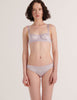 A model in the araks silk gita underwire bra and gwyneth panty in fairy lavender