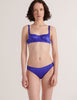 A model in the araks silk gita underwire bra and gwyneth panty in tanzanite blue