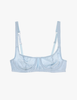 A flat lay of the araks silk gita underwire bra in glace blue