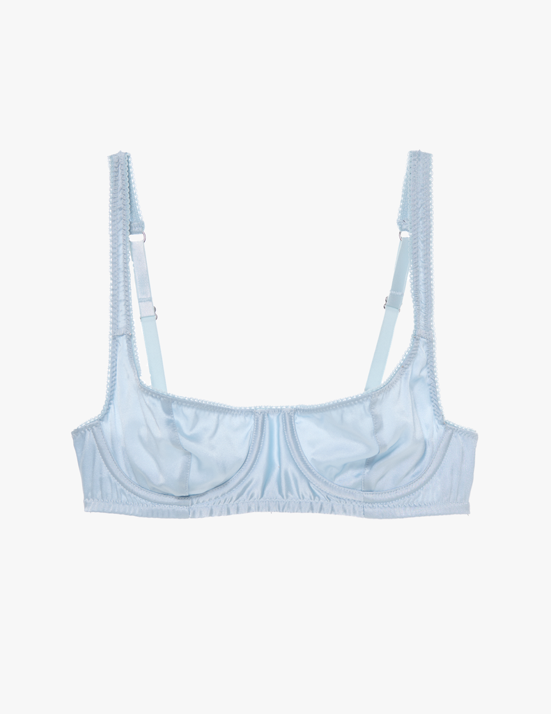 A flat lay of the araks silk gita underwire bra in glace blue