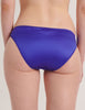 A close up of the araks silk gwyneth panty in tanzanite blue on a model
