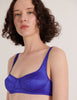 A model in the araks silk penelope bralette in tanzanite blue