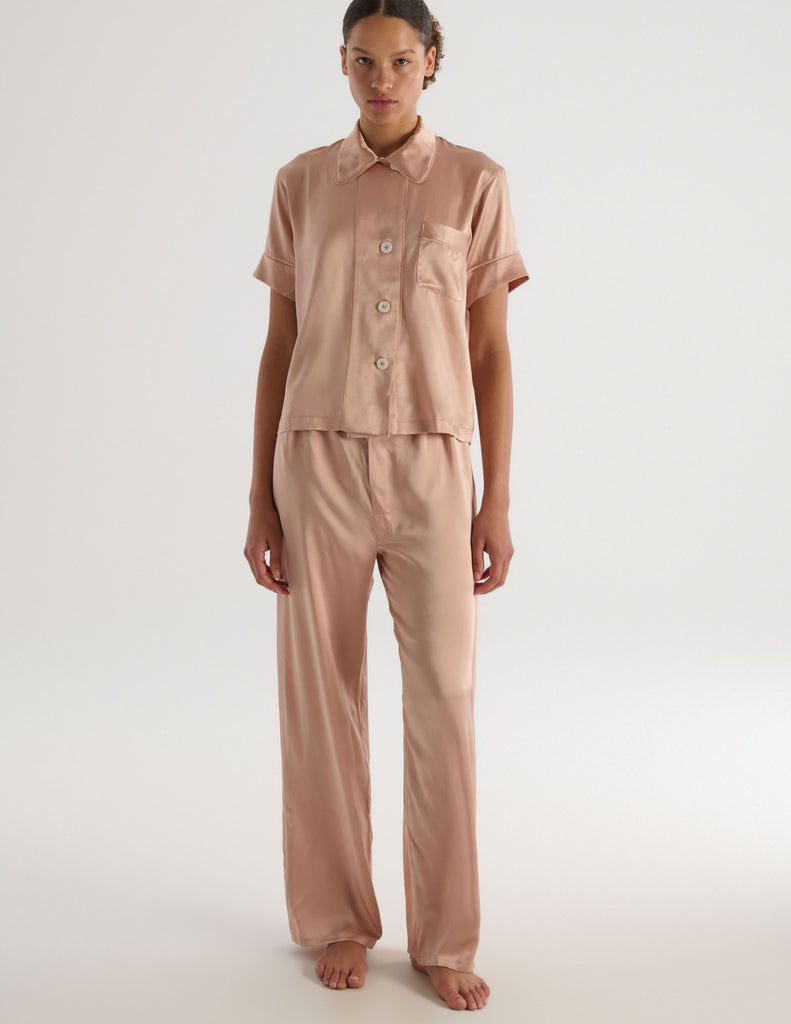 A front view of the shelby pajama top and viktoria pajama bottom in beige silk charmeuse.