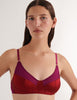 A model in the araks willow bralette in cranberry red