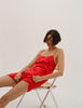 model wearing the Araks Toulouse slip in scarlet