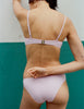 A model in the araks ovsanna bikini top and piper bikini bottom in ballet pink