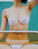 A model in the araks ovsanna bikini top and piper bikini bottom in ballet pink