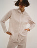A model in the araks cotton suki pajama top and teagen pajama pant in stripe 