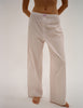 A model in the araks teagen pajama pant in tart stripe 
