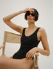 Model wearing Araks Harley one piece bathing suit in black