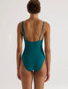 A model in the araks jamie one piece in fern green