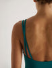 A model in the araks jamie one piece in fern green