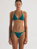 A model in the araks nelle bikini top and nadia bikini bottom in fern green