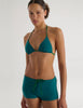 A model in the araks nelle bikini top and polly short in fern green