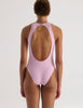 A model in the araks tolle one piece in ballet pink