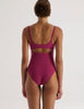 A model in the araks natalie one piece in cerise red