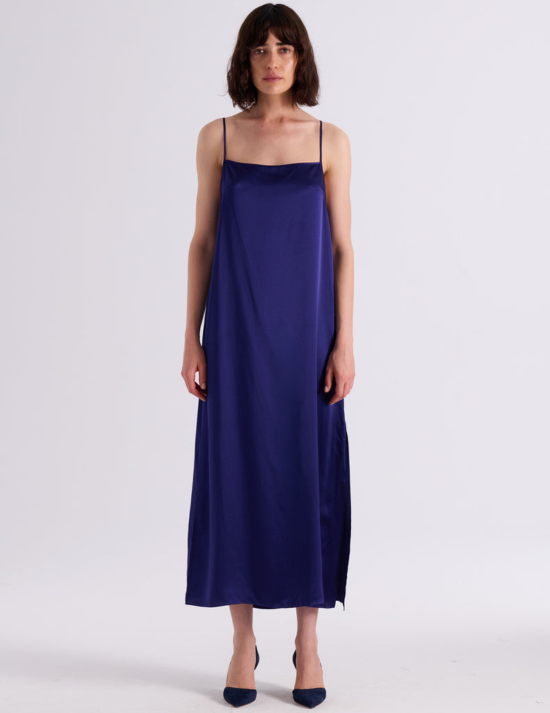 Model wearing Araka vika slip dress in starling